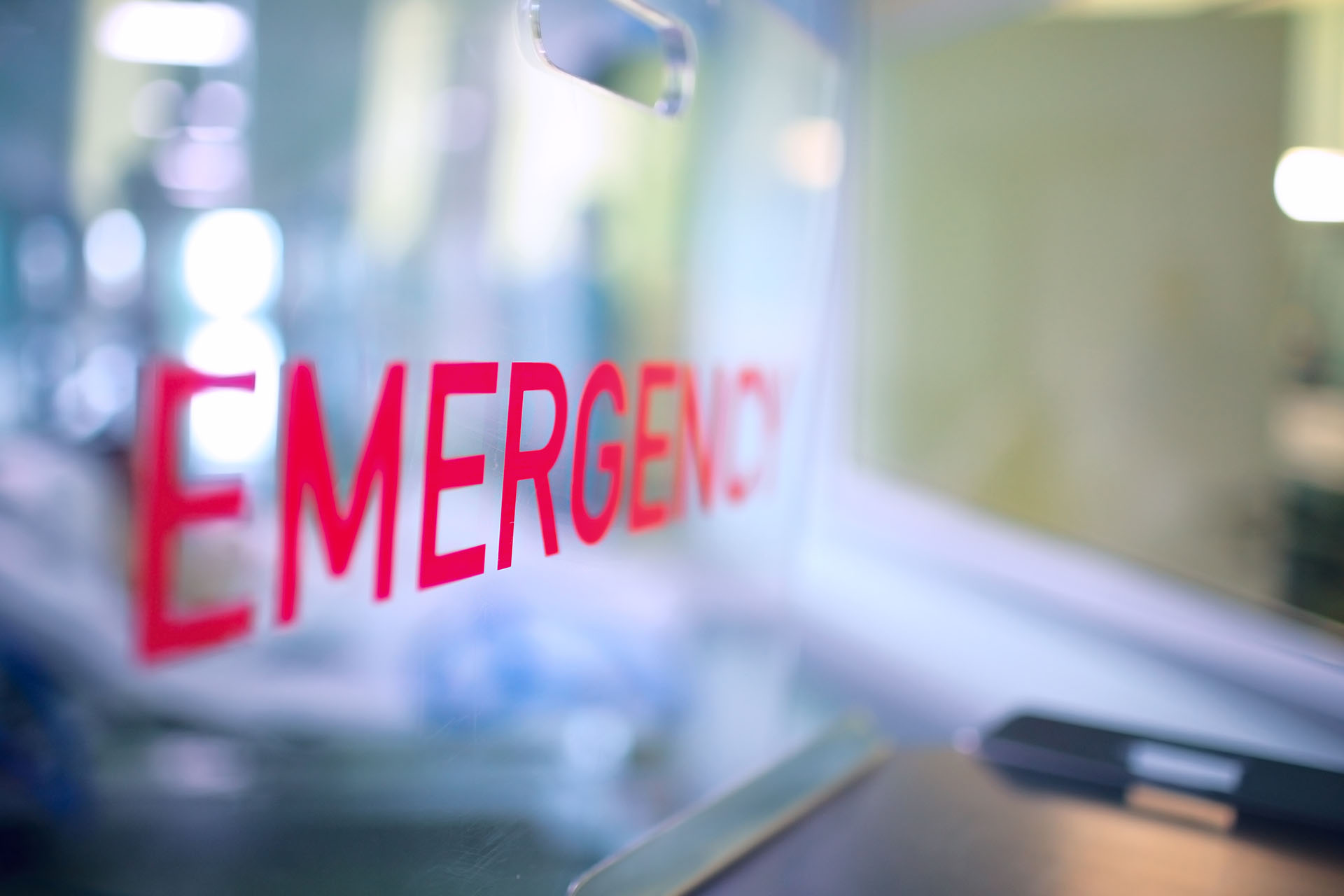Close up image of Emergency room signage in red lettering